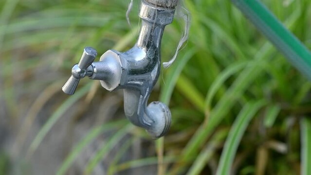 Garden water faucet dripping