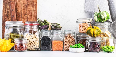 Fotobehang Legumes and beans set in jars. Dried, raw and fresh. Lentils, chickpeas, mung beans, soybeans, edamame, peas. Healthy diet food, vegan protein, micronutrients and fiber sources © 5ph