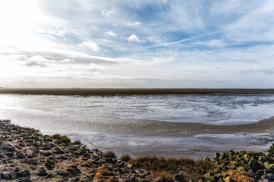 Mudflats area at low tide in the 'Wadden' Sea near the village 'Holwerd' in the province of 'Friesland', the Netherlands