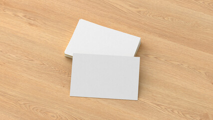 Business card mockup. Stack of business cards on wooden background. Side view