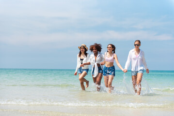 Group of teenage friends having fun on the beach summer, Lifestyles on weekend and vacation, Travel concept.