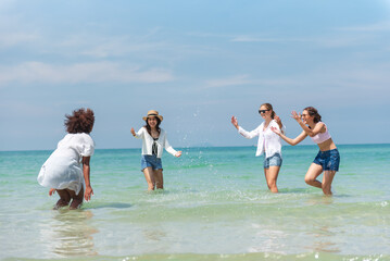 Group of teenage friends having fun on the beach summer, Lifestyles on weekend and vacation, Travel concept.