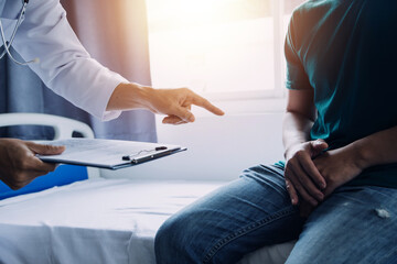 Doctor and patient discussing something while sitting at the table . Medicine and health care concept. Doctor and patient