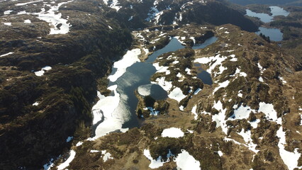 Norway mountains, fjord. Village on the fjord. Summer in Norway. Beautiful landscape. Sun rays through the clouds