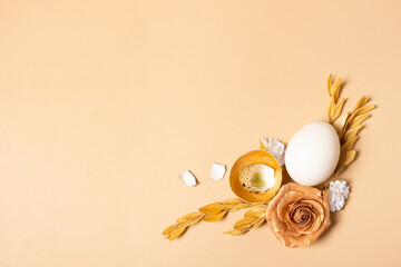 Modern creative composition with easter eggs, leaves and flowers top view. Easter flat lay