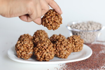 Puffed finger millet sweet ball or Ragi kurmura ladu. Sweet balls made of puffed and roasted finger millet and jaggery syrup