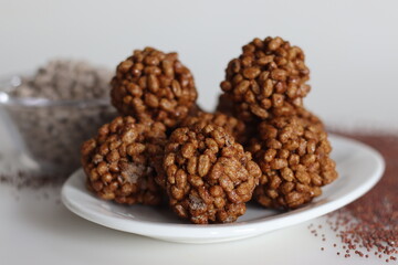 Puffed finger millet sweet ball or Ragi kurmura ladu. Sweet balls made of puffed and roasted finger millet and jaggery syrup