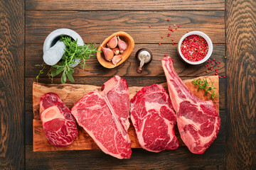 Raw prime steaks. Variety of fresh black angus prime meat steaks T-bone, New York, Ribeye,...