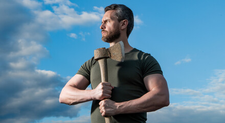 strong man with axe. logger man hold ax. brutal man on sky background