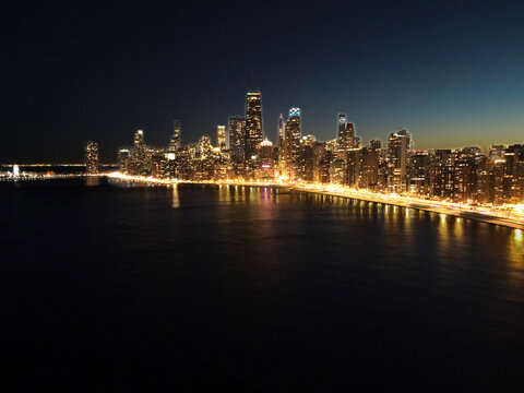 Aerial view of the downtown city of Chicago, Illinois, skyline at night. USA 2023