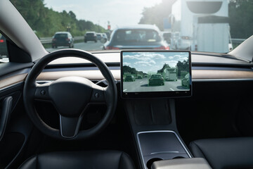 Self driving car on a road. Autonomous vehicle. Inside view.	