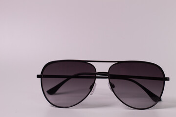 Close-Up Of black Sunglasses.  isolated on white background.