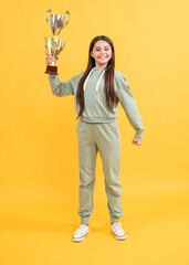 smiling teen champion girl isolated on yellow. teen champion girl in studio.