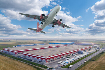 Airplane in the sky above the logistic center. World trade and transportation concept	