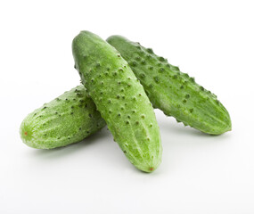Natural food concept. Side view photo of ripe cucumbers isolated on white background