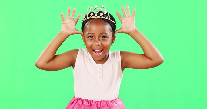 Children, playful and princess with a black girl on a green screen background in studio feeling silly or goofy. Kids, cute and happy with an adorable little girl playing or having fun on chromakey