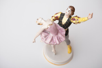 Porcelain figurine, a pair of dancing ballerinas on a white background.