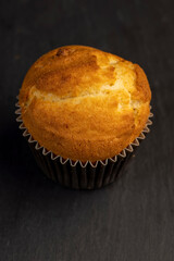 Soft and fresh fragrant wheat cupcake on a black stone
