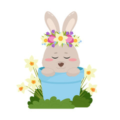 A cute bunny sits in a blue pot among narcissus flowers. Easter Bunny, holiday decor. Spring