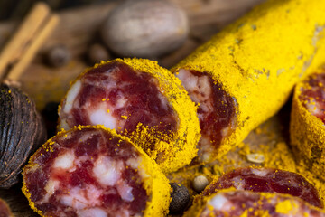Sliced beef salami with spices and lots of turmeric