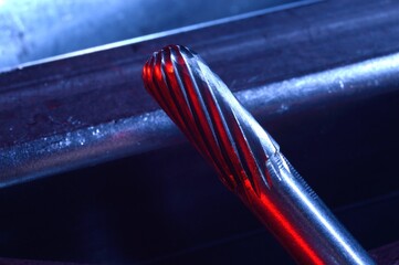 cutters of tungsten carbide on the background of metal blanks. Close-up.