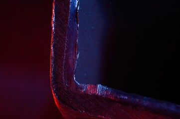 metal scraps. Macro. illuminated in red and blue.