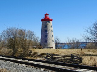 lighthouse on the shore of the river