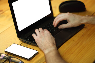 a person typing on a laptop keyboard