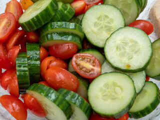 Chopped cucumbers and tomatoes. Salad with cucumbers and tomatoes. close-up.