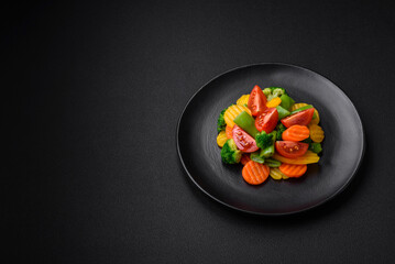 Salad of fresh and steamed vegetables cherry tomatoes, broccoli and carrots