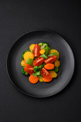Salad of fresh and steamed vegetables cherry tomatoes, broccoli and carrots