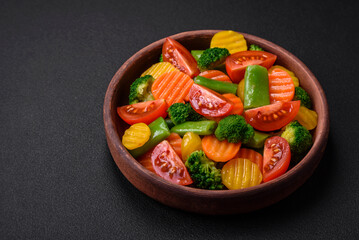Salad of fresh and steamed vegetables cherry tomatoes, broccoli and carrots