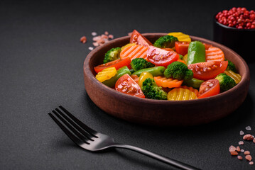 Salad of fresh and steamed vegetables cherry tomatoes, broccoli and carrots