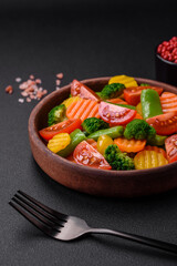 Salad of fresh and steamed vegetables cherry tomatoes, broccoli and carrots
