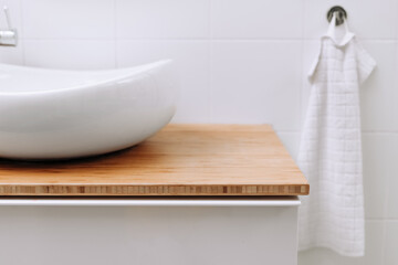 Stylish vessel sink close up with free space for cosmetics in stylish bathroom interior