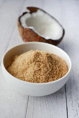 coconut sugar in a white bowl on table 