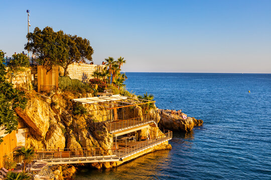 Sunset view of Colline du Chateau Castle Hill, Vieille Ville Castel Beach and Tour Bellanda Tower in Nice on French Riviera of Mediterranean Sea in France