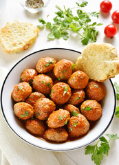 Meatballs with tomato sauce in bowl