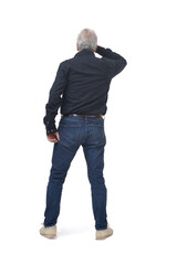 Naklejka premium back view of standing man looking away with hand on forehead on white background