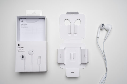 New Apple Earpods, Airpods white headphones for listening to music and podcasts in an open box. Isolated on white background. Budapest, Hungary - February 16, 2023