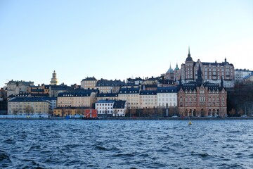 Fototapeta premium Stockholm waterfront view towards Sodermalm district with historic Mariahissen building and Monteliusvagen, Sweden, Scandinavia 