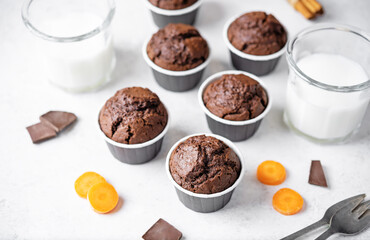 Fresh chocolate carrot muffins with drink