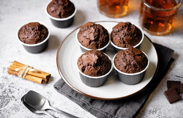 Fresh chocolate carrot muffins with drink