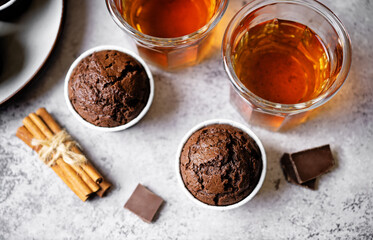 Fresh chocolate carrot muffins with drink