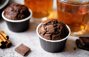 Fresh chocolate carrot muffins with drink