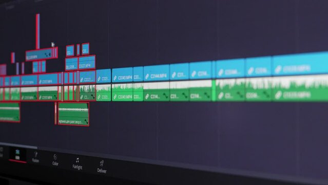 Close up of video editing time line and computer monitor as video editor works on edit Video editing on computer. fix work of program for video editing, video processing, post-production, clip maker