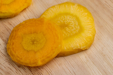 Sliced bright yellow carrots on the table