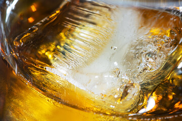 Closeup of photo of whiskey glass with ice. - 582278538