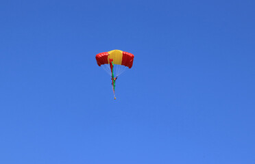 flying with a parachute on a summer day