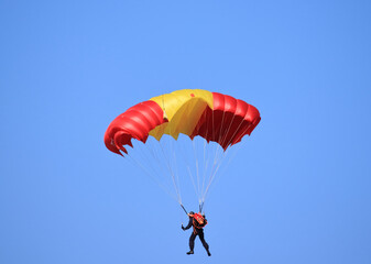 flying with a parachute on a summer day